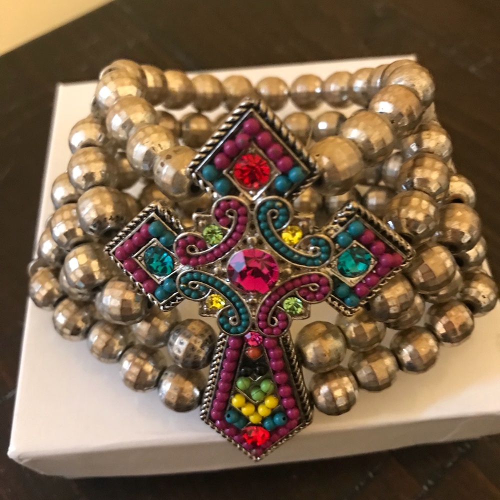 Wide bracelet with jeweled cross